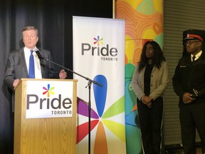 (from left) Mayor John Tory, Pride Toronto executive director Olivia Nuamah and Toronto Police Chief Mark Saunders during Pride Toronto announcement that police will be allowed to apply to march in 2019’s parade after a two-year ban on Oct. 16, 2018.