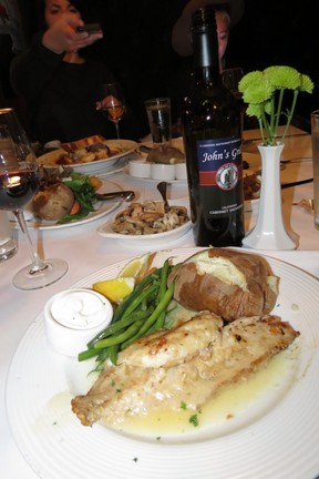 My super supper: Red snapper, with baked potato, sour cream, green beans, mushrooms and fried onions, with bottle of John’s Grill red wine, at John’s Grill, 63 Ellis St., San Francisco.