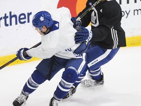 Maple Leafs' Jake Gardiner and Tyler Ennis will play in their 500th career game on Saturday night. The two battle at practice in Toronto on Friday October 26, 2018. (CRAIG ROBERTSON/TORONTO SUN)