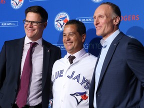 From left: Blue Jays GM Ross Atkins, new manager Charlie Montoyo, and president Mark Shapiro at a news conference on Monday. (Dave Abel/Toronto Sun)
