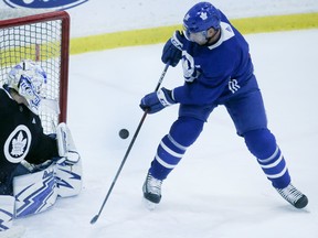 Maple Leafs' John Tavares takes part in drills with goalie Frederick Andersen on Friday. (VERONICA HENRI/TORONTO SUN)