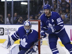 Maple Leafs' John Tavares cuts around the net in front of goalie Frederik Andersen during Wednesday night's season-opener against the Canadiens in Toronto. (JACK BOLAND/TORONTO SUN)