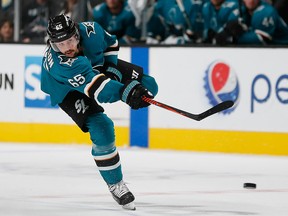 In this Sept. 27, 2018, file photo, San Jose Sharks defenceman Erik Karlsson shoots against the Calgary Flames during the third period of a preseason NHL game in San Jose, Calif.