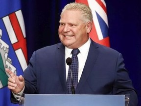 Ontario Premier Doug Ford speaks to supporters at an anti-carbon tax rally in Calgary, Oct. 5, 2018.