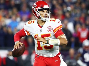 Patrick Mahomes  of the Kansas City Chiefs looks to pass in the second quarter of a game against the New England Patriots at Gillette Stadium on Oct. 14, 2018 in Foxborough, Mass.