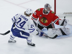 Maple Leafs winger Kasperi Kapanen, sent in alone by Auston Matthews, puts a shot over the glove of Blackhawks goalie Cam Ward on Sunday in Chicago. Kamil Krzaczynski/AP