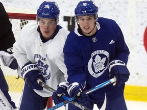 Maple Leafs centre Auston Matthews and teammate Mitch Marner (16) get tied up in front of the net during practice at the MasterCard Centre in Toronto on October 27, 2017. (Craig Robertson/Toronto Sun)