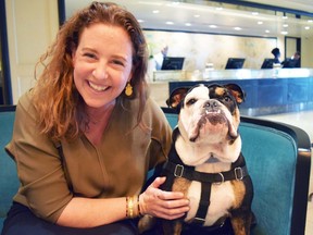 Mary Spellerberg, assistant director of sales at The London West Hollywood, hangs with bulldog mascot, Winston, in the hotel's lobby. (Steve MacNaull photo)