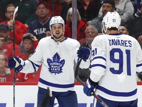 Maple Leafs' Auston Matthews (left) celebrates his goal with John Tavares on Thursday against the Red Wings in Detroit. (AP PHOTO)