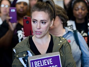 Alyssa Milano gathers with other activists in the office of Senator Susan M. Collins (R-ME) during protests against Judge Brett Kavanaugh on Capitol Hill Sept. 26, 2018 in Washington, D.C.