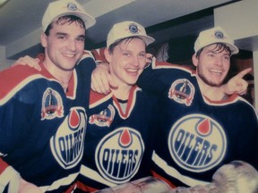 Joe Murphy, left, with linemates Adam Graves and Martin Gelinas celebrating the 1990 Stanley Cup win.