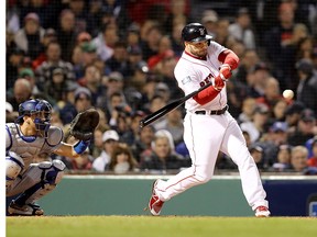 Steve Pearce of the Boston Red Sox grounds into a fielder's choice during the third inning against the Los Angeles Dodgers in Game 1 of the 2018 World Series at Fenway Park on Oct. 23, 2018 in Boston, Mass.