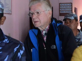 Canadian pedophile Ernest Fenwick (Fen) MacIntosh is taken to prison by cops in Nepal after his conviction. He has now been released and is reportedly in Ontario.