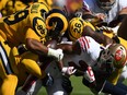 Aaron Donald of the Los Angeles Rams strips the ball from Matt Breida of the San Francisco 49ers at Levi's Stadium on October 21, 2018 in Santa Clara, California. The Rams simply don`t have any weaknesses. (Thearon W. Henderson/Getty Images)