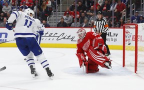 Maple Leafs’ Zach Hyman watches a Morgan Rielly shot go in for a goal on Detroit Red Wings goaltender Jimmy Howard during the first period on Thursday night in Detroit. (AP PHOTO)