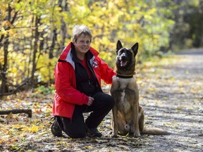 Kim Cooper of the Ottawa Valley Search and Rescue Dog Association is seen with her dog Grief in Stittsville, Ont., on Tuesday, Oct. 30, 2018.