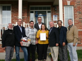 Pickering Mayor Dave Ryan, members of council and representatives from Mattamy Homes welcome Brittney Hirst and Keith Hunter to the Seaton community.