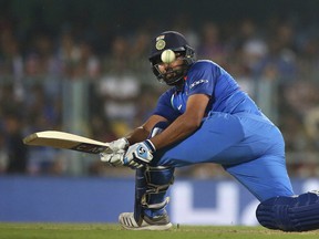 India's Rohit Sharma plays a shot during the first one-day international cricket match between India and West Indies in Gauhati, India, Sunday, Oct. 21, 2018. (AP Photo)