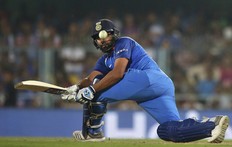 India's Rohit Sharma plays a shot during the first one-day international cricket match between India and West Indies in Gauhati, India, Sunday, Oct. 21, 2018. (AP Photo)
