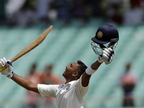 India’s cricketer Prithvi Shaw celebrates his century during the first day of the first Test match between India and West Indies in Rajkot, India,last Thursday. (THE ASSOCIATED PRESS)