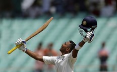 India’s cricketer Prithvi Shaw celebrates his century during the first day of the first Test match between India and West Indies in Rajkot, India,last Thursday. (THE ASSOCIATED PRESS)