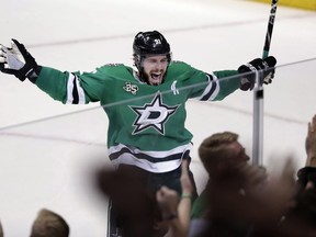 Dallas Stars' Tyler Seguin (91) celebrates their 3-2 overtime win in an NHL hockey game against the St. Louis Blues in Dallas on March 3, 2018. (AP Photo/Tony Gutierrez, File)