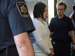 Terri-Lynne McClintic, convicted in the death of 8-year-old Woodstock, Ont., girl Victoria Stafford, is escorted into court in Kitchener, Ont., on Wednesday, September 12, 2012 for her trial in an assault on another inmate while in prison.