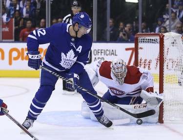 Toronto Maple Leafs Patrick Marleau C (12) tries to tip the puck past Montreal Canadiens Carey Price G (31)during the first period in Toronto on Wednesday October 3, 2018. Jack Boland/Toronto Sun/Postmedia Network
