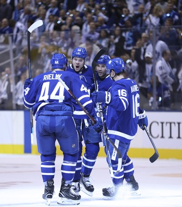 Toronto Maple Leafs Auston Matthews C (34) celebrates his first goal of the season tying the game during the first period in Toronto on Wednesday October 3, 2018. Jack Boland/Toronto Sun/Postmedia Network