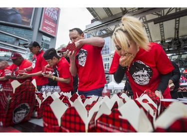 Miki Sudo, who is reported to be the top female professional eater (#7-ranked overall), during Toronto'sÊ9th Annual SmokeÕs Poutinerie World Poutine Eating Championship Yonge-Dundas Square in Toronto, Ont. on Saturday October 13, 2018. Ernest Doroszuk/Toronto Sun/Postmedia