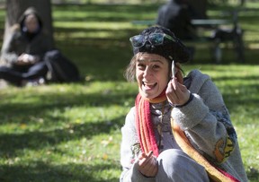 Anna Sapershteyn smokes a joint at Trinity Bellwood Park on Wednesday. (Craig Robertson/Toronto Sun)