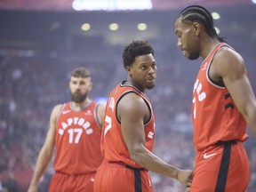 Toronto Raptors forward Kawhi Leonard (2) and Toronto Raptors guard Kyle Lowry (7)n Toronto, Ont. on Wednesday October 17, 2018. Toronto Raptors host the Cleveland Cavaliers at the Scotiabank Arena.  Veronica Henri/Toronto Sun/Postmedia Network