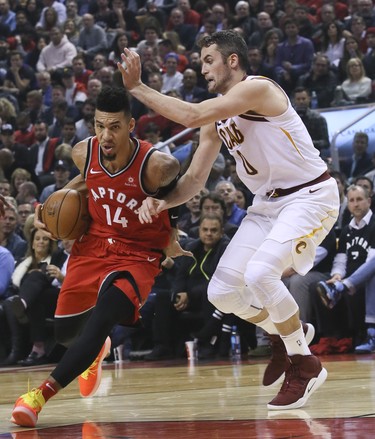 Toronto Raptors guard Danny Green (14) in his first game as a Raptor as Cleveland Cavaliers forward Kevin Love (0) attempting to block him n Toronto, Ont. on Wednesday October 17, 2018. Toronto Raptors host the Cleveland Cavaliers at the Scotiabank Arena.  (Veronica Henri/Toronto Sun/Postmedia Network)