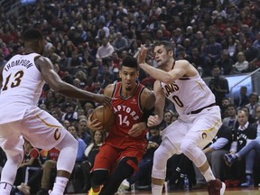 Raptors’ Danny Green drives between Tristan Thompson and Kevin Love of the Cleveland Cavaliers during Wednesday’s season opener at Scotiabank Arena. Green contributed 11 points to the Raptors’ 116-104 victory.  VERONICA HENRI/TORONTO SUN
