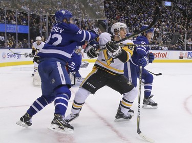 Toronto Maple Leafs Nikita Zaitsev D (22) works over Pittsburgh Penguins Sidney Crosby C (87) during the second period in Toronto on Thursday October 18, 2018. Jack Boland/Toronto Sun/Postmedia Network