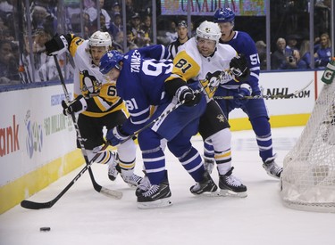 Pittsburgh Penguins Phil Kessel RW (81) checking Toronto Maple Leafs John Tavares C (91) during the second period in Toronto on Thursday October 18, 2018. Jack Boland/Toronto Sun/Postmedia Network