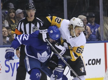 Pittsburgh Penguins Carl Hagelin LW (62) tangles with Toronto Maple Leafs Nikita Zaitsev D (22) during the second period in Toronto on Thursday October 18, 2018. Jack Boland/Toronto Sun/Postmedia Network