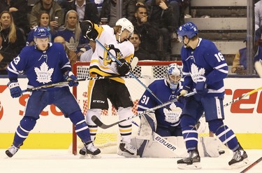 Pittsburgh Penguins Carl Hagelin LW (62) tries to redirect the puck past Toronto Maple Leafs Frederik Andersen G (31) during the third period in Toronto on Thursday October 18, 2018. Jack Boland/Toronto Sun/Postmedia Network