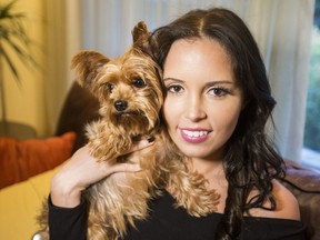 Monica Niemkiewicz with her dog Muffy on Wednesday, October 24, 2018. Muffy was stolen in a robbery and has just been reunited with her owner. Craig Robertson/Toronto Sun