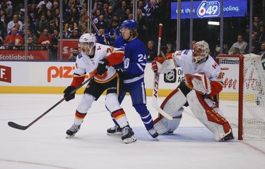 Calgary Flames Travis Hamonic D (24) and Toronto Maple Leafs Kasperi Kapanen RW (24) in front of Mike Smith G (41)during the first period in Toronto on Monday October 29, 2018. Jack Boland/Toronto Sun/Postmedia Network