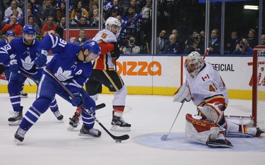 Toronto Maple Leafs John Tavares C (91) tries to get it past Calgary Flames Mike Smith G (41) on a late power play during the first period in Toronto on Monday October 29, 2018. Jack Boland/Toronto Sun/Postmedia Network
