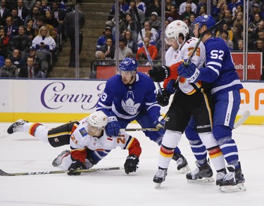 Toronto Maple Leafs Frederik Gauthier C (33) takes down Calgary Flames Garnet Hathaway RW (21) during the second period in Toronto on Monday October 29, 2018. Jack Boland/Toronto Sun/Postmedia Network