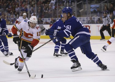 Calgary Flames Johnny Gaudreau LW (13) blows around Toronto Maple Leafs Jake Gardiner D (51) with ease during the second period in Toronto on Tuesday October 30, 2018. Jack Boland/Toronto Sun/Postmedia Network