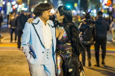 Joel Natareno and Lena Kovacs channeling Sonny and Cher as Halloween comes to the Village as a part of Church St. is closed to traffic for Halloween on Church in Toronto, Ont. on Wednesday October 31, 2018. Ernest Doroszuk/Toronto Sun/Postmedia