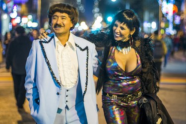 Joel Natareno and Lena Kovacs channeling Sonny and Cher as Halloween comes to the Village as a part of Church St. is closed to traffic for Halloween on Church in Toronto, Ont. on Wednesday October 31, 2018. Ernest Doroszuk/Toronto Sun/Postmedia