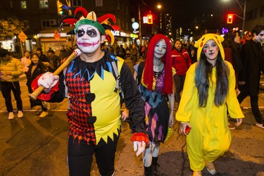 Elzimar Neto (from left), Yayoi Kameda and Susana Martinez as Halloween comes to the Village as a part of Church St. is closed to traffic for Halloween on Church in Toronto, Ont. on Wednesday October 31, 2018. Ernest Doroszuk/Toronto Sun/Postmedia