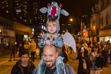 Tomi Sphere and his daughter Aleia,2, as Halloween comes to the Village as a part of Church St. is closed to traffic for Halloween on Church in Toronto, Ont. on Wednesday October 31, 2018. Ernest Doroszuk/Toronto Sun/Postmedia