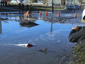 A TTC Wheels Trans vehicle became submerged in a massive sink hole on Commissioners St. west of Logan Ave. around 5:30 a.m.  Tuesday October 30, 2018. Jack Boland/Toronto Sun