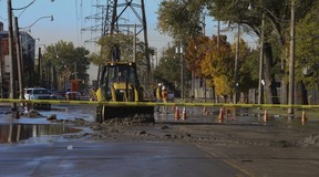 A TTC Wheels Trans vehicle became submerged in a massive sink hole on Commissioners St. west of Logan Ave. around 5:30 a.m. Tuesday October 30, 2018. Jack Boland/Toronto Sun