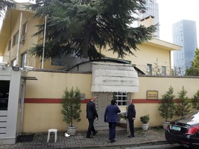 Saudi officials enter Saudi Arabia's consulate in Istanbul, Friday, Oct. 12, 2018. A senior Turkish official says Turkey and Saudi Arabia will form a "joint working group" to look into the disappearance of Saudi writer Jamal Khashoggi who vanished last week after entering the Saudi diplomatic mission in Istanbul.